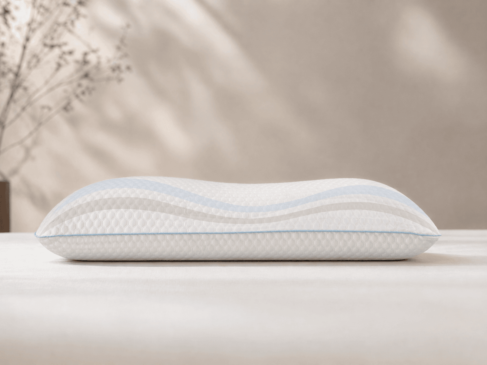 Maple Sleep pillow with a subtle support-zone profile overlay.